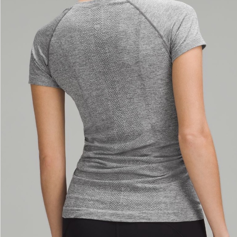 Size 6 lululemon swiftly tech barely used grey no rips no tags stretchy fabric